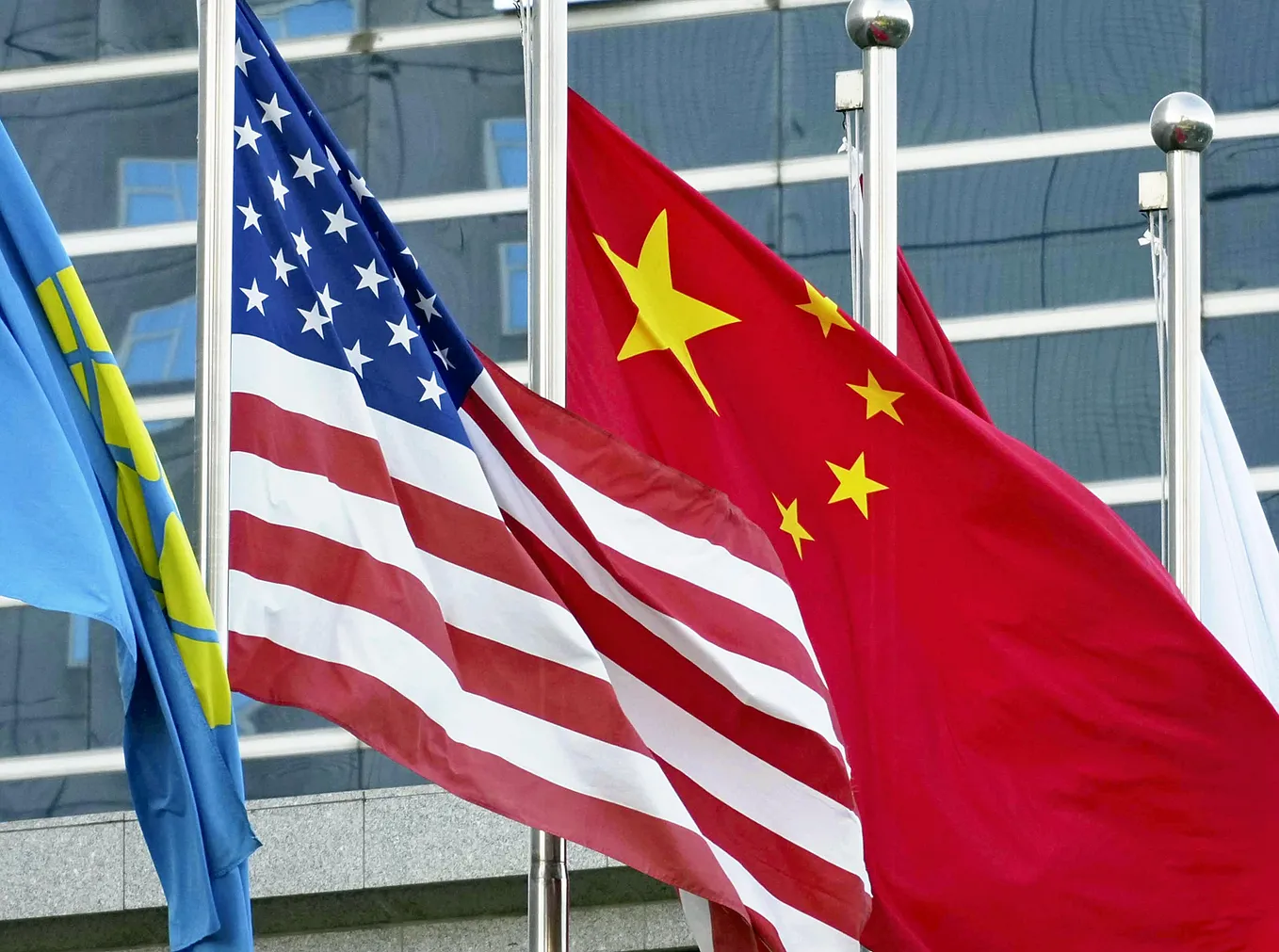 National flags of the United States and China are raised in Beijing, China, October 8, 2024. Photo by Ichiro Ohara/The Yomiuri Shimbun via Reuters