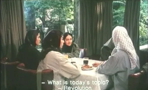 A group of women talking to each other, and the subtitles read “What is today’s topic?”, to which someone replies “Revolution”.