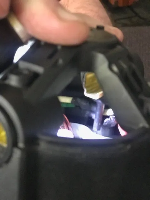 Top of motor housing showing plastic pin with wires routed behind it