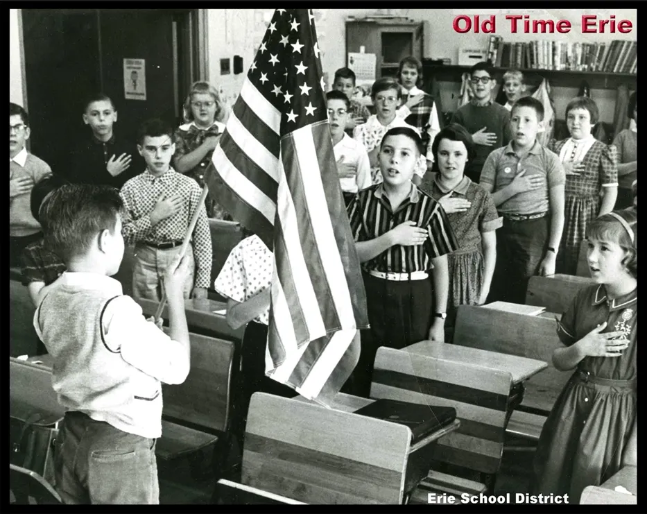 Elementary school students reciting the Pledge of Allegiance.