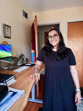 Aparna Bankston at her standing desk in her home office.