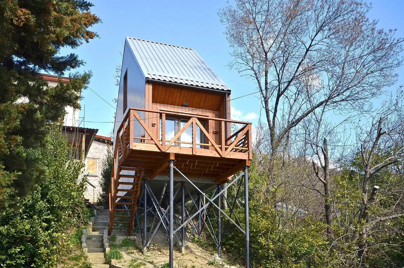 wood and metal cabin on stilts
