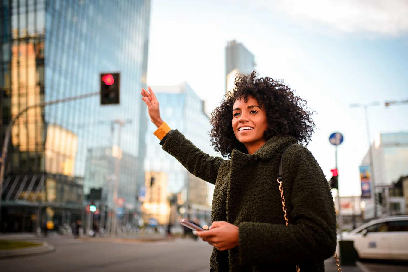 a women street hailing with mobile