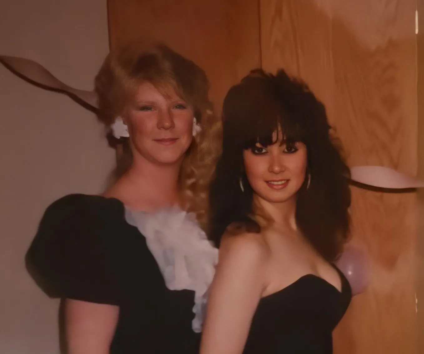 Two young women dressed up for a college formal, mid 1980s