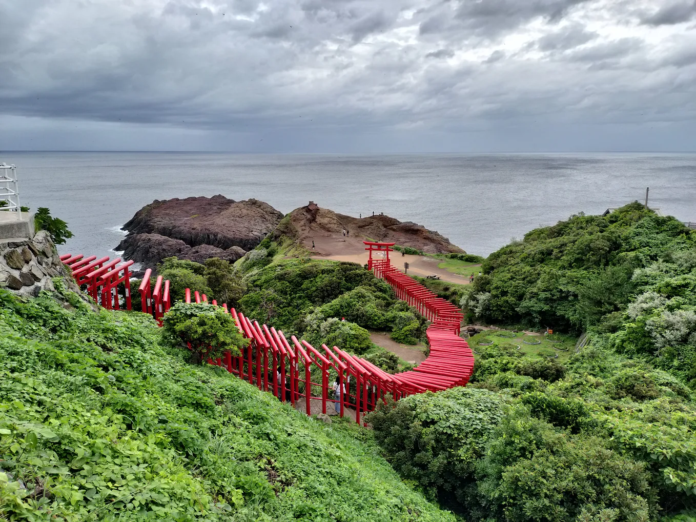 Motonosumi Inari Shrine — a picture of a row of torii gates located by the coast in Northern Yamaguchi prefecture.