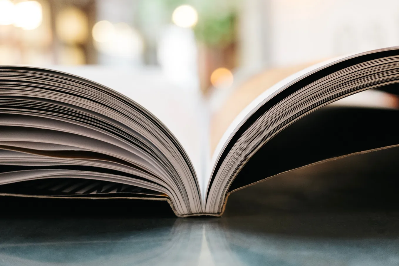 A book is spread open on a table.