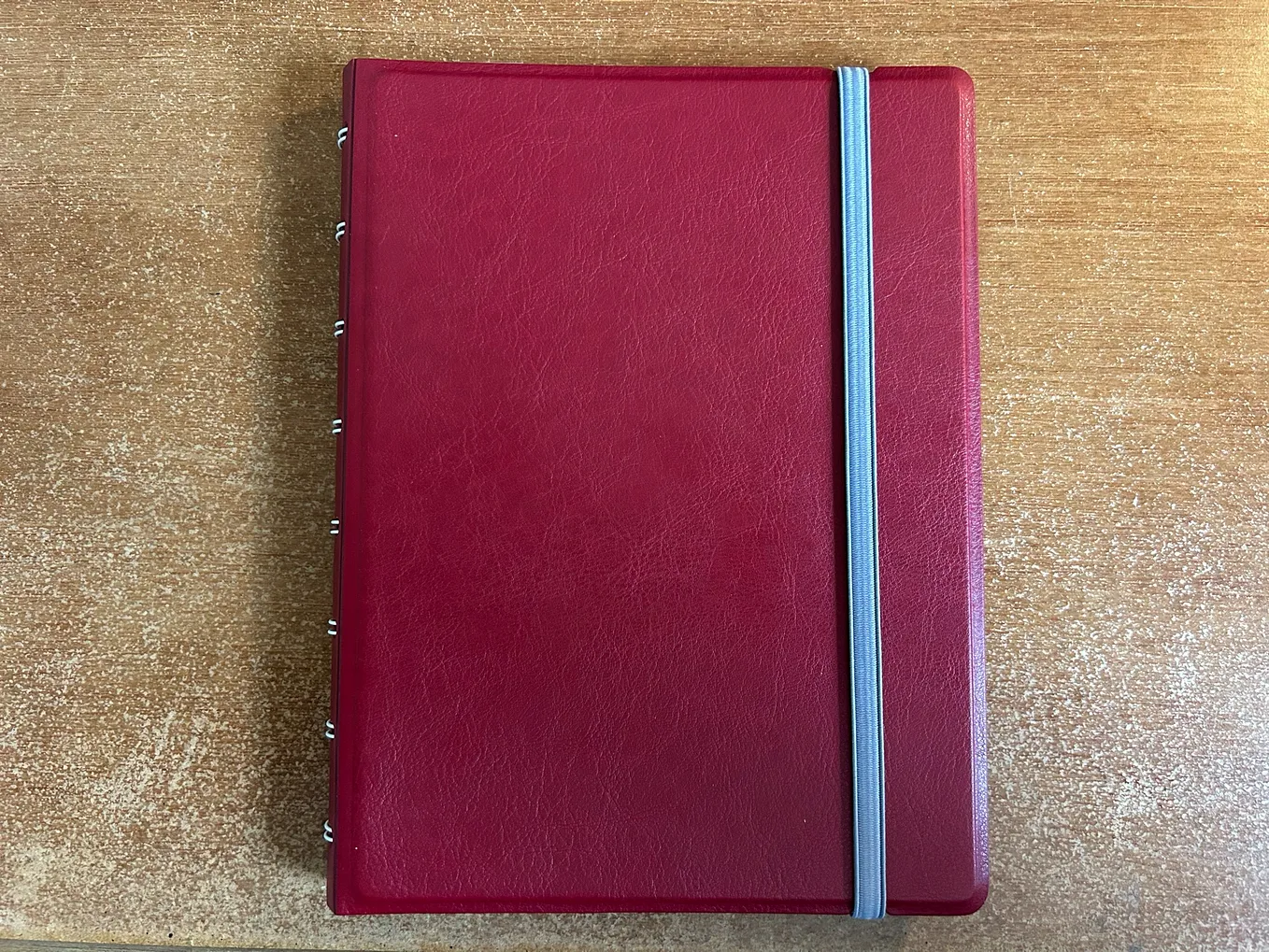 A refillable notebook made by Filofax the masters of paper organisition