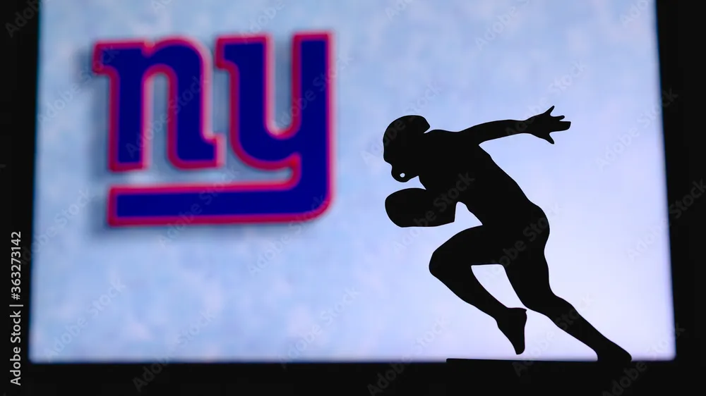 Silhouette of football player running with red and blue NY logo in background.