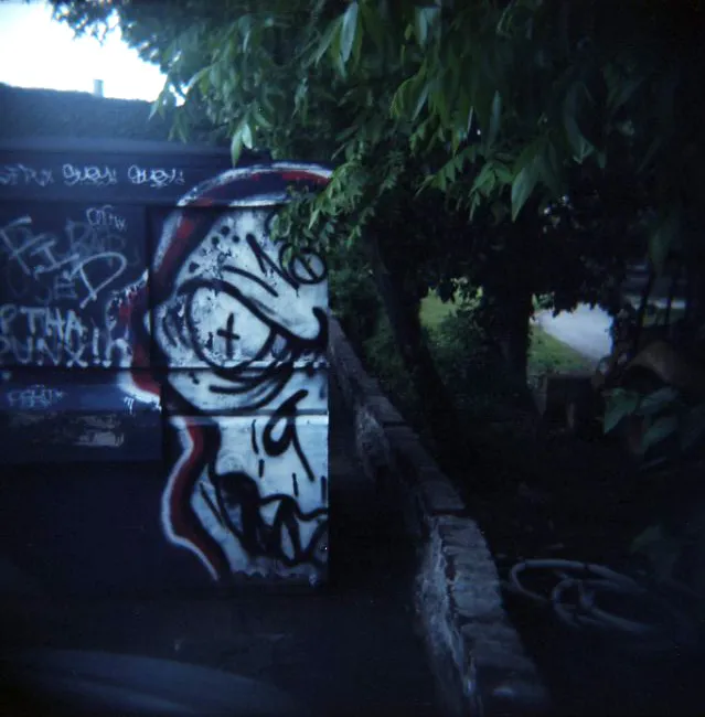 dumpster with graffiti art on it