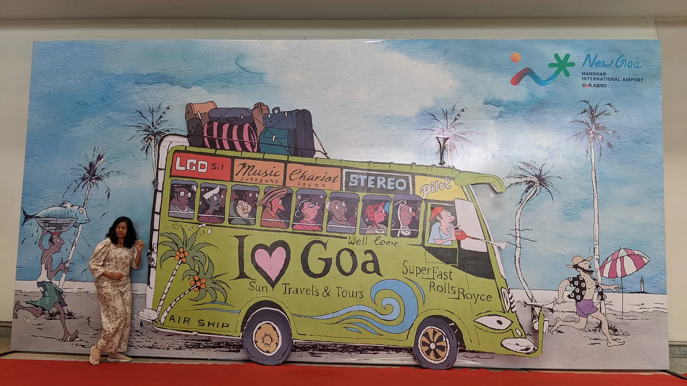 Photo of the author merging into the artwork at Goa airport.