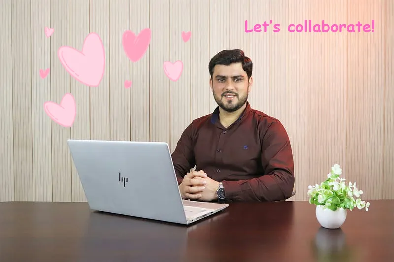 A man sitting pleasantly at his computer smiling
