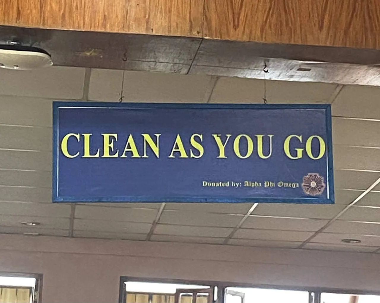 A ‘clean as you go’ sign posted at the University of the Philippines Baguio Cafeteria. (Photo taken by Krizial Apog)