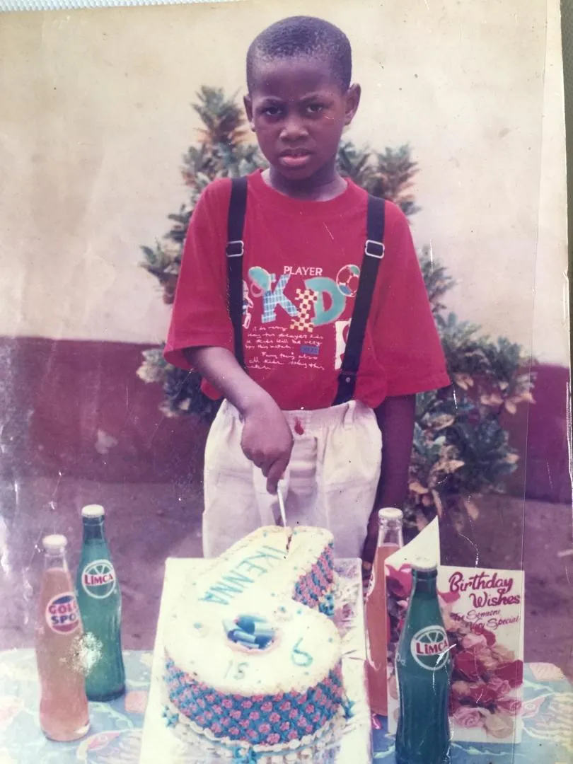 A picture of me cutting a cake on my sixth birthday.