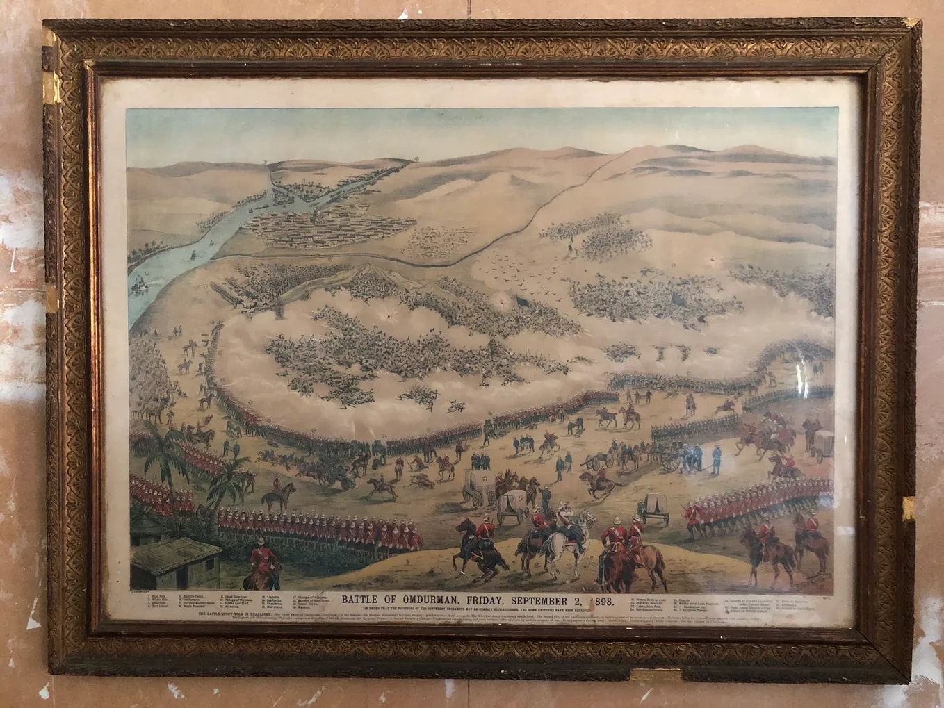 Antique picture of a battle in the desert in a gilt frame