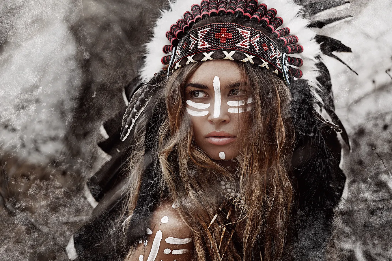 A female warrior is wearing a warbonnet.
