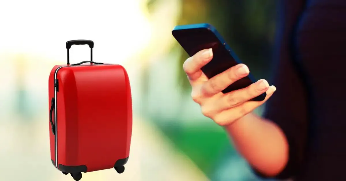 girl with iphone using airtag to locate her luggage with a red suitcase in picture