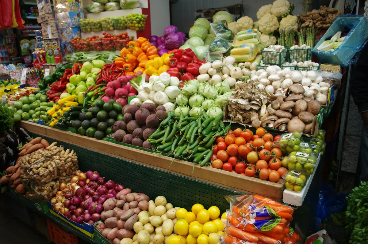 A produce aisle display in a well-stocked grocery store.