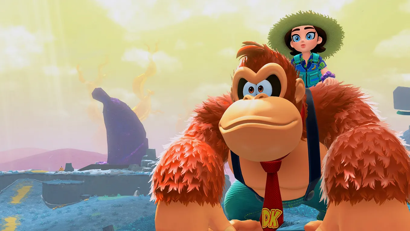 Donkey Kong and Pauline explore the second sublayer of Bananza, while a mysterious purple banana structure sits in the distance to the left. Donkey Kong wears a tie and some pants, and Pauline has on a fun vacation outfit with a large sun hat.