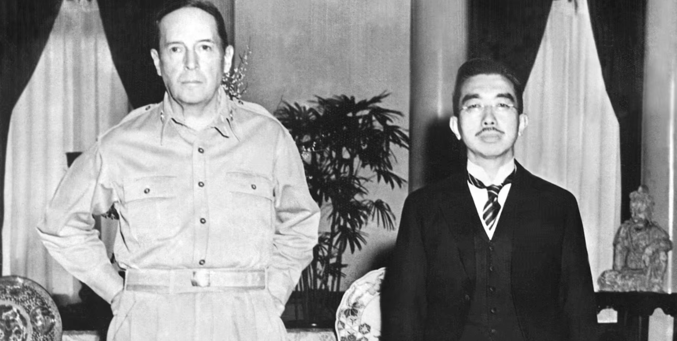General Douglas MacArthur and Emperor Hirohito at Allied General Headquarters in Tokyo, September 17, 1945. Photograph by Pictures from History / Universal Images Group via Getty Images.