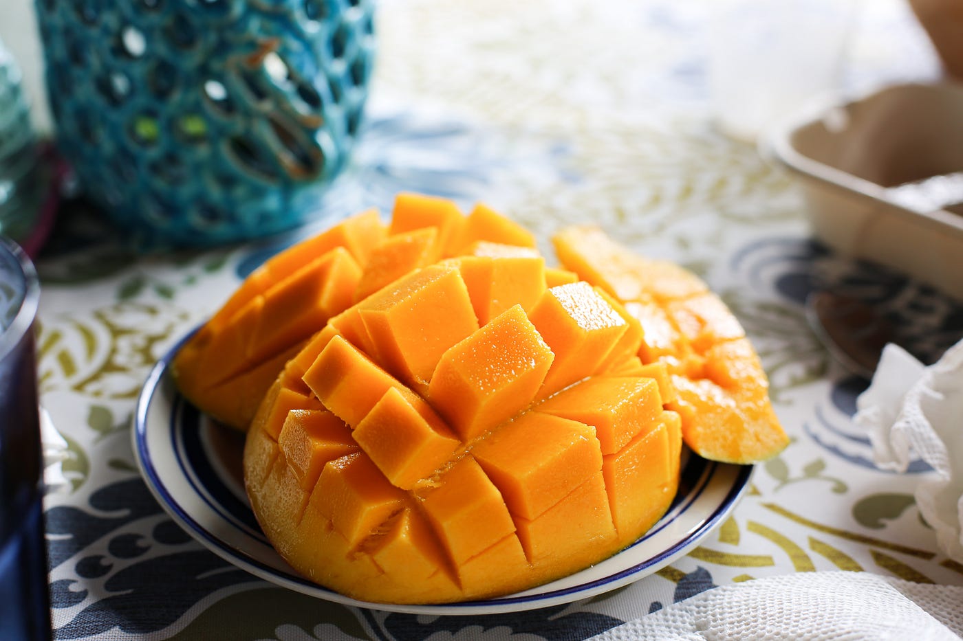 A picture depicting a ripe, juicy sliced mango