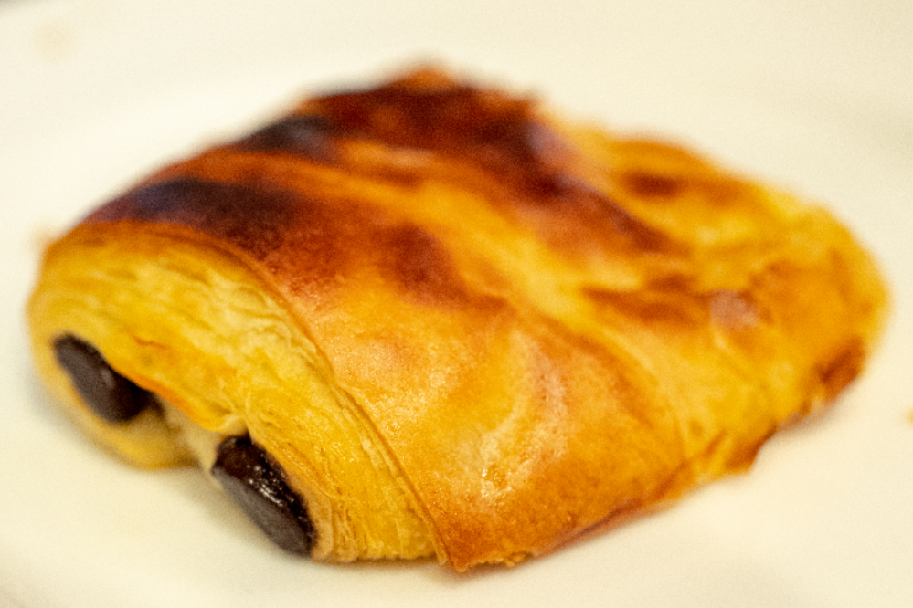 A pastry that has been filled with dark jam.