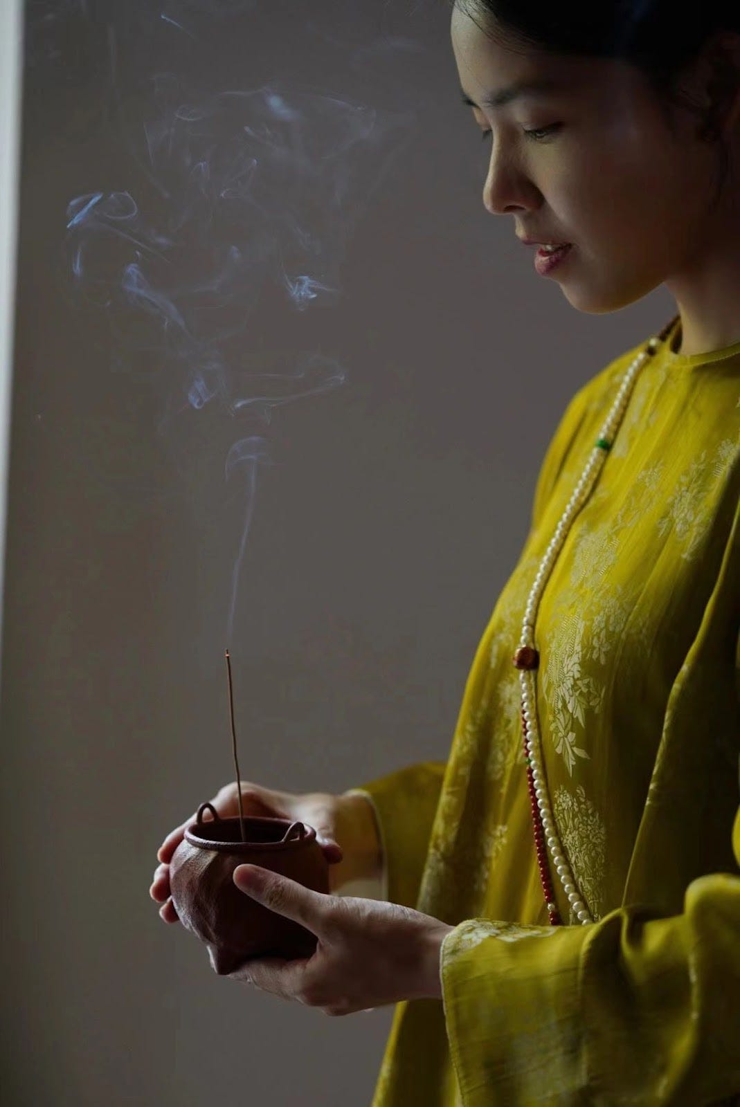 Elegant Chinese Lady using Incenzo Incense