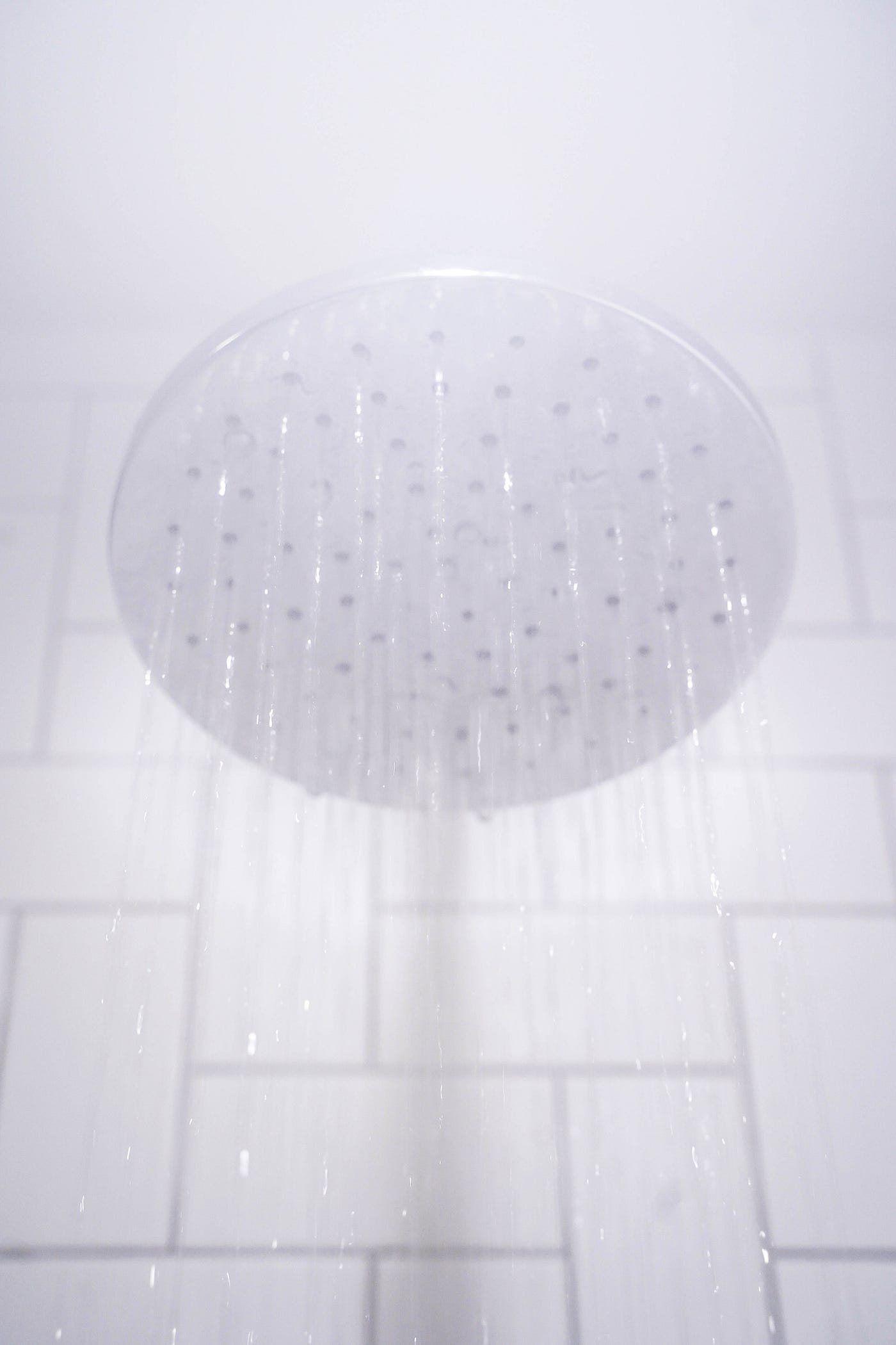 A shower head, seen in closeup, with fog around it. If we are not getting enough sleep, our bodies prioritize deep sleep. I try to facilitate more deep sleep with these tactics: I take a warm shower (or bath) two hours before sleep. I optimize my diet. I sometimes listen to binaural beats before bedtime.