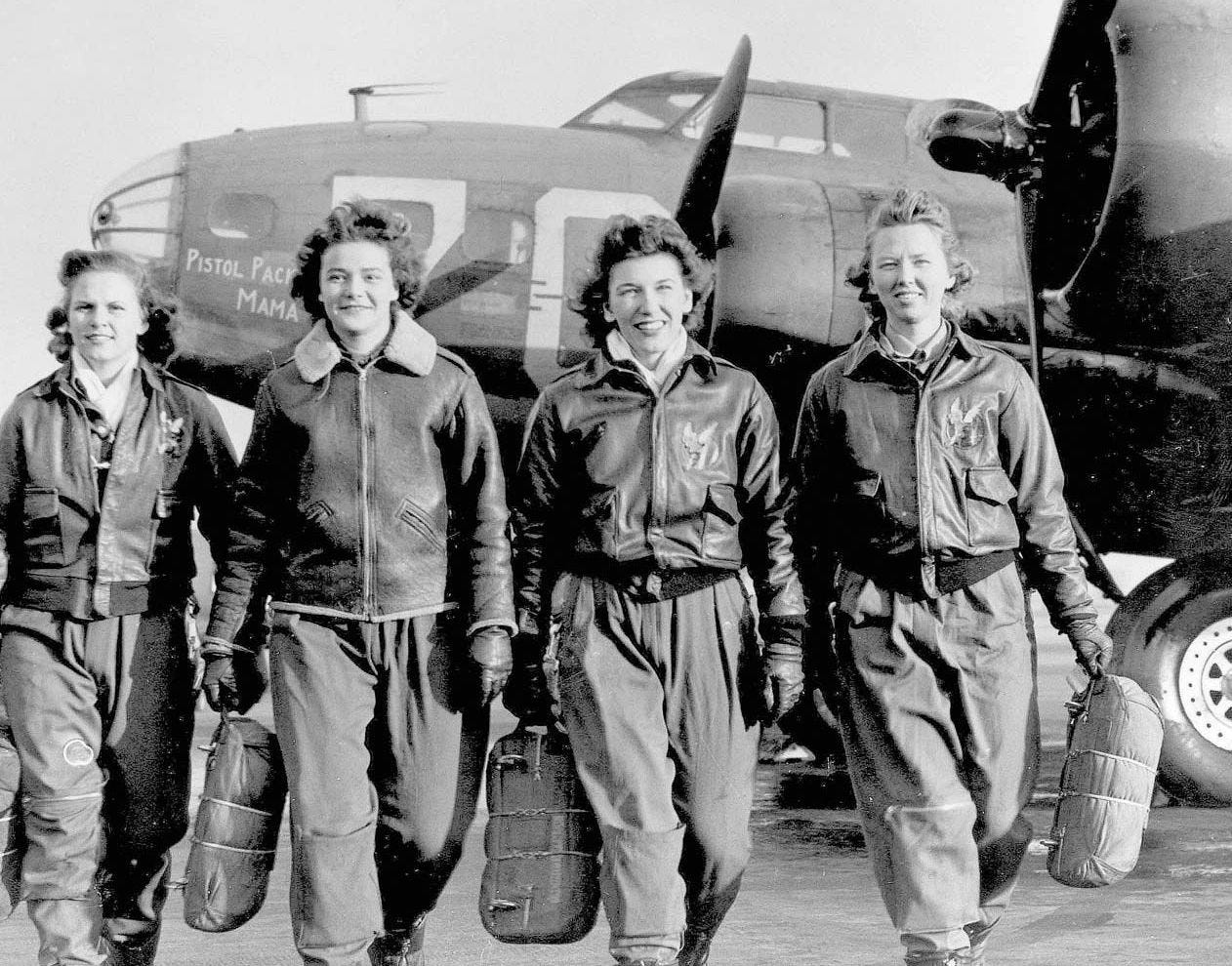 mickey markoff air sea exec 2024 — women aviation service pilots in uniform and bomber jackets standing in front of military aircraft; black and white photo