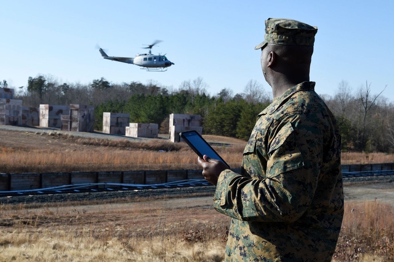 Mickey Markoff 2023 Air Sea Exec — person in us military uniform holding tablet, manning UAV helicopter from ground, posted on article about autonomous helicopters