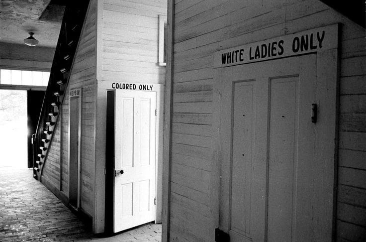Bob Adelman, Louisiana. Clinton. 1964. Segregated bathrooms in the city courthouse. Photo: © Bob Adelman/Magnum Photos — All Rights Reserved.