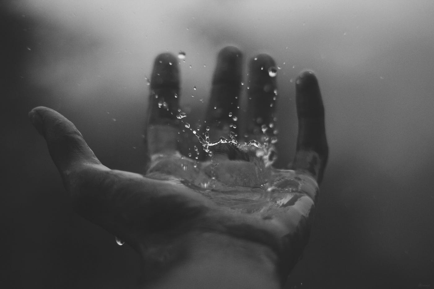 “time lapse photography of water hitting left palm” by Geetanjal Khanna on Unsplash