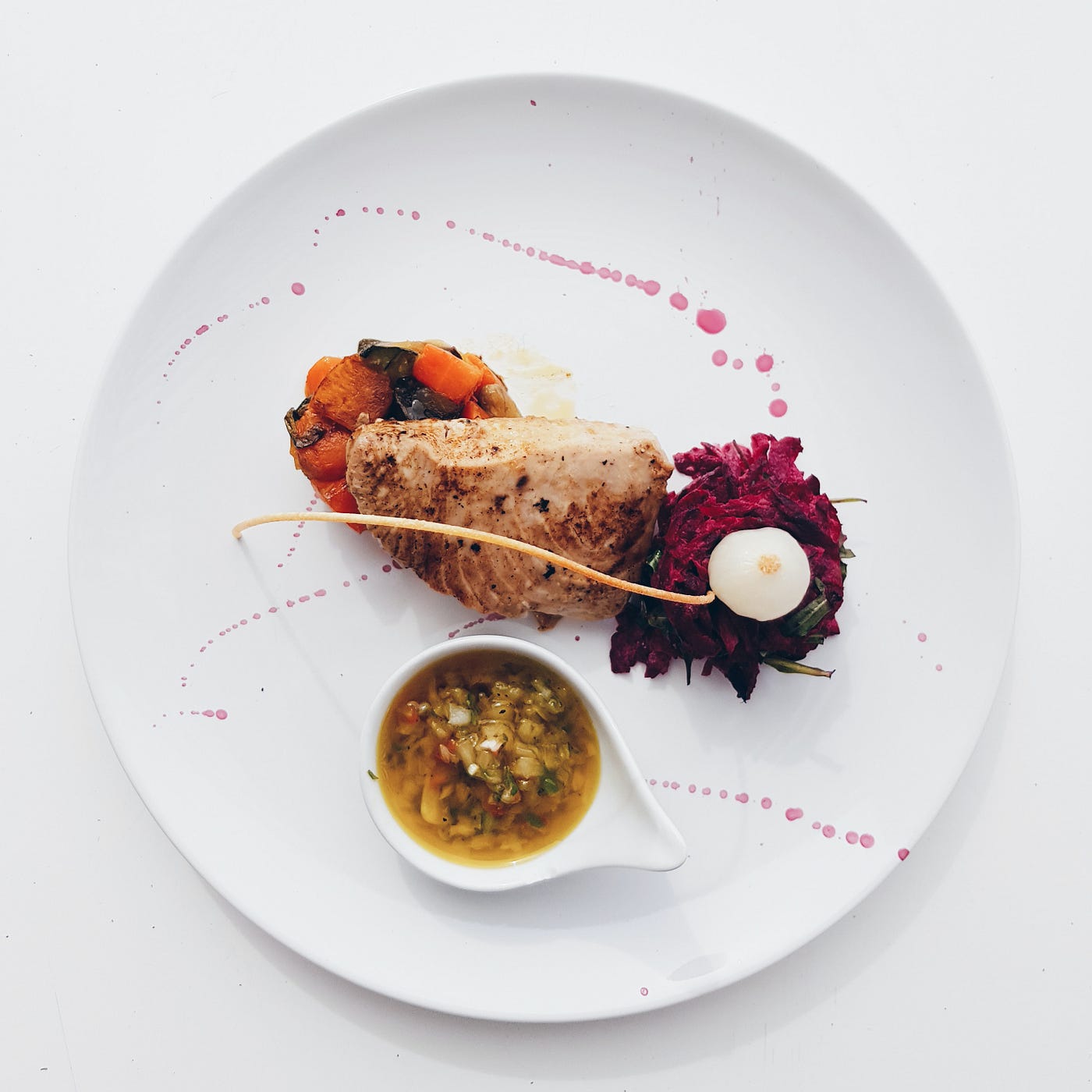 A healthy meal on a simple white plate. Keeping a consistent meal schedule from day to day is associated with weight loss, energy increases, and a drop in metabolic risk factors for chronic disease.