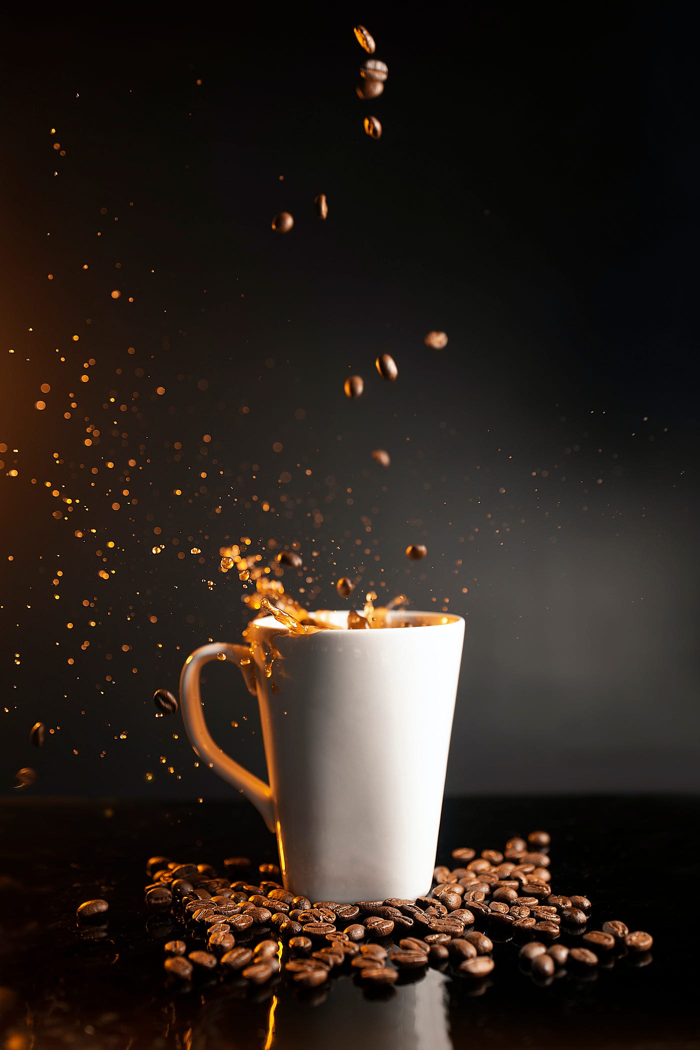 A photo of coffee beans frop into a tall white cup of coffee, splashing its contents upward. Those who consumed either coffee or caffeine had decreased connectivity in their default mode network after consumption. This change indicates preparation for the brain to move from resting to working on tasks. But… Those consuming pure caffeine had no increased connectivity in their visual and executive control networks. The coffee drinkers did. Caffeine may awaken you, but it won’t make you more sharp.