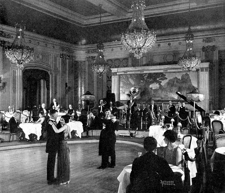 Vintage photo of people dancing in a ballroom.