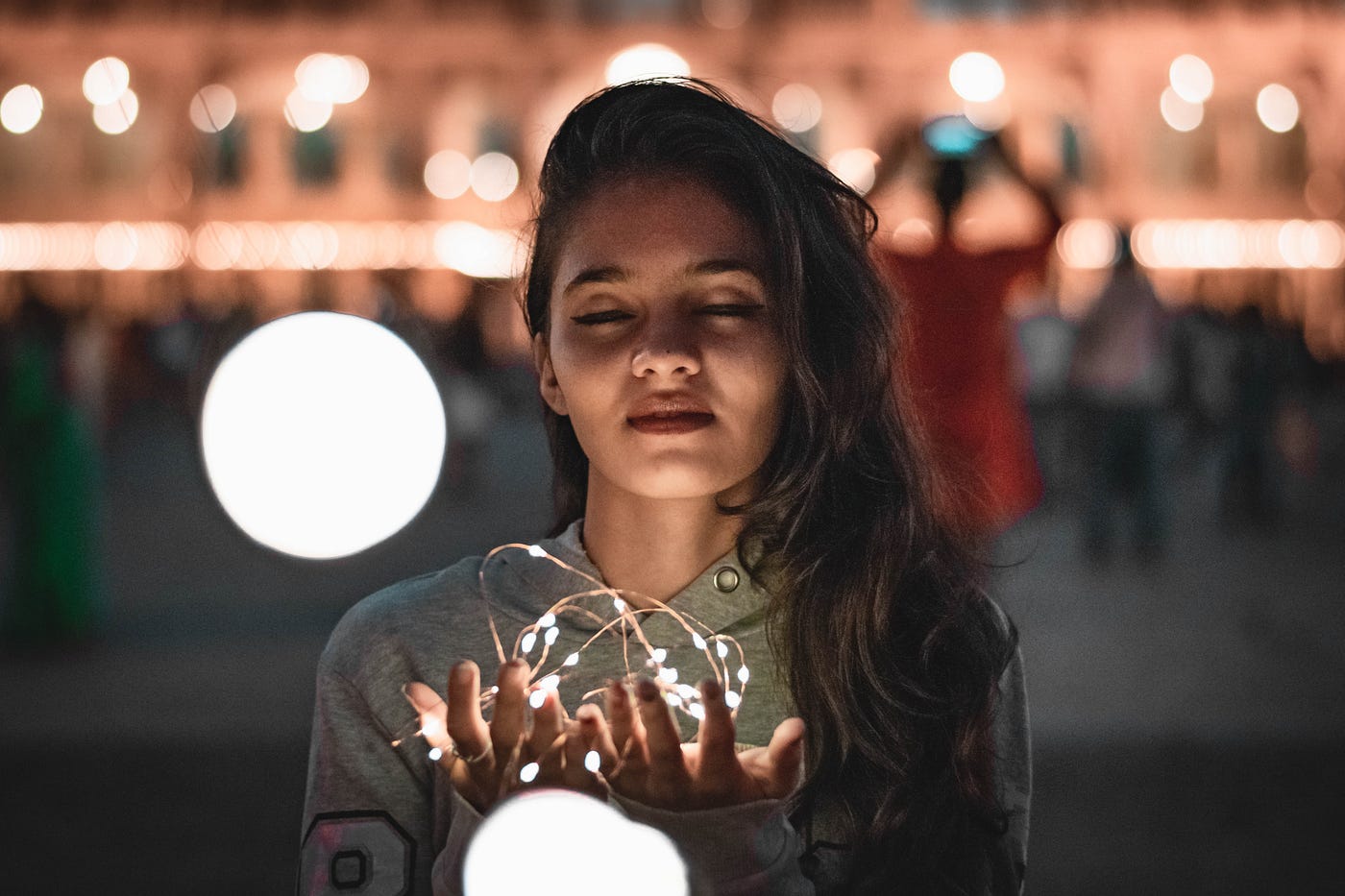 women with eyes closed experiencing something