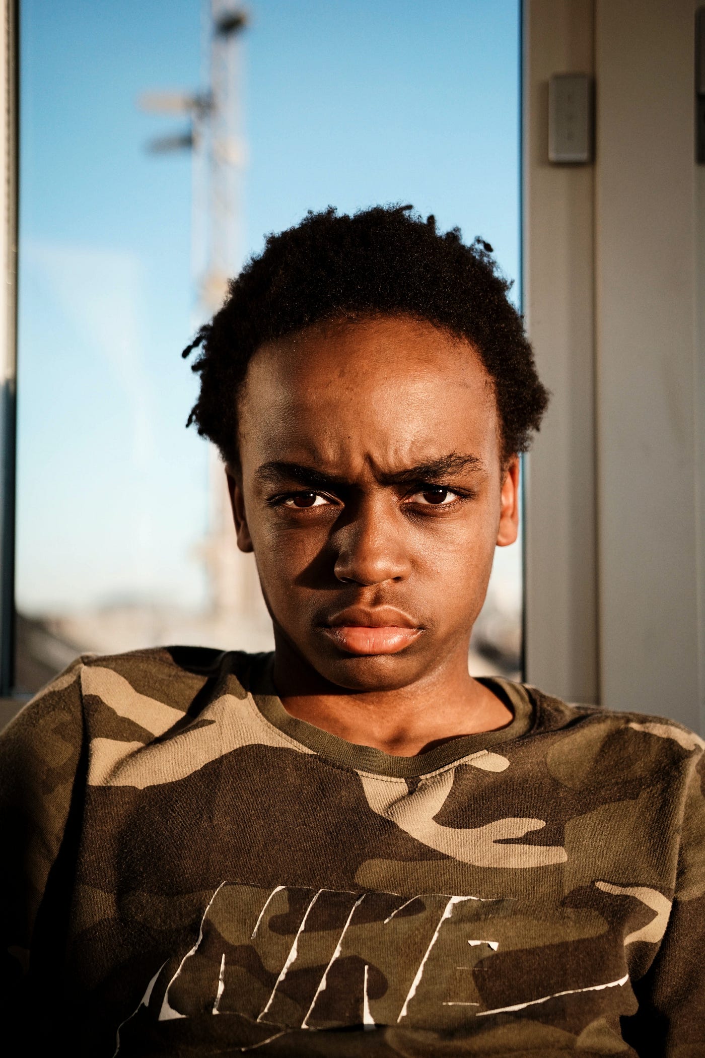 An African boy who looks annoyed
