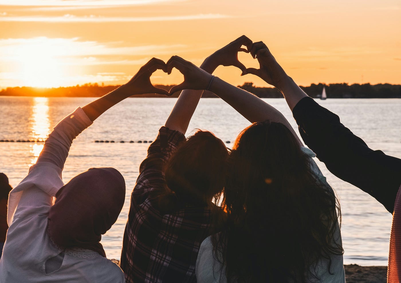 credit https://unsplash.com/photos/people-near-body-of-water-during-golden-hour-oy0GnmE8lh0