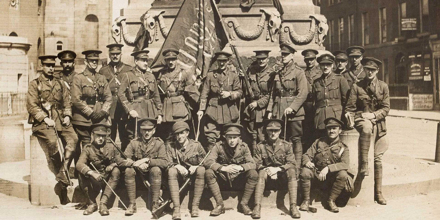 Officers of the 3rd RIR pose with a captured rebel flag