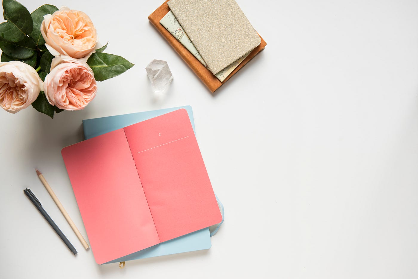 A couple of boxes sitting on top of an open book photo – Free Flatlay Image  on Unsplash