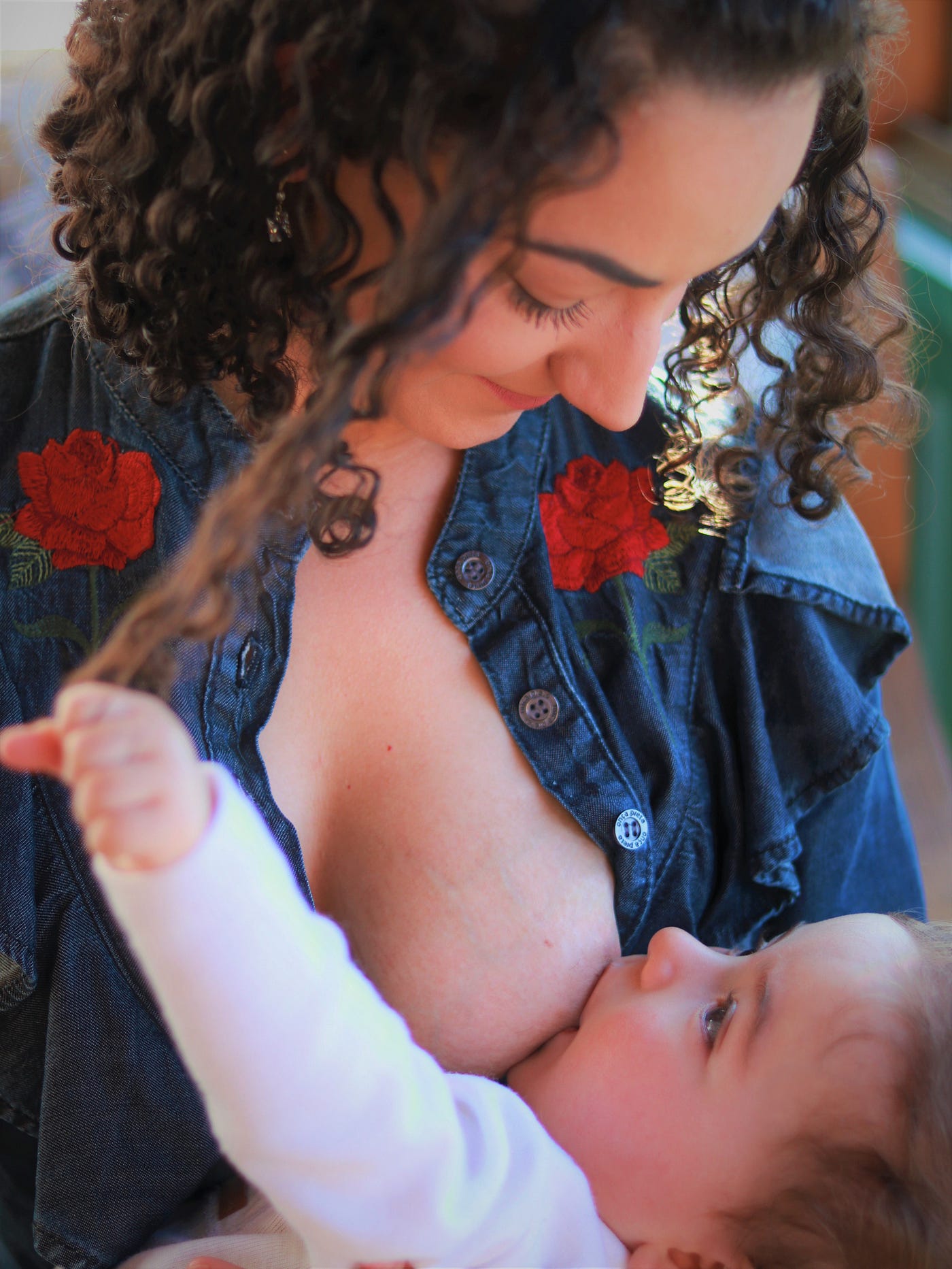 Furious mums hold breastfeeding sit in after staff asked one not