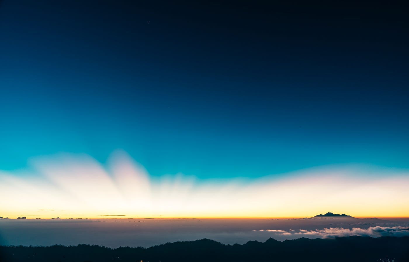 Image of a distant horizon with light coming up from it
