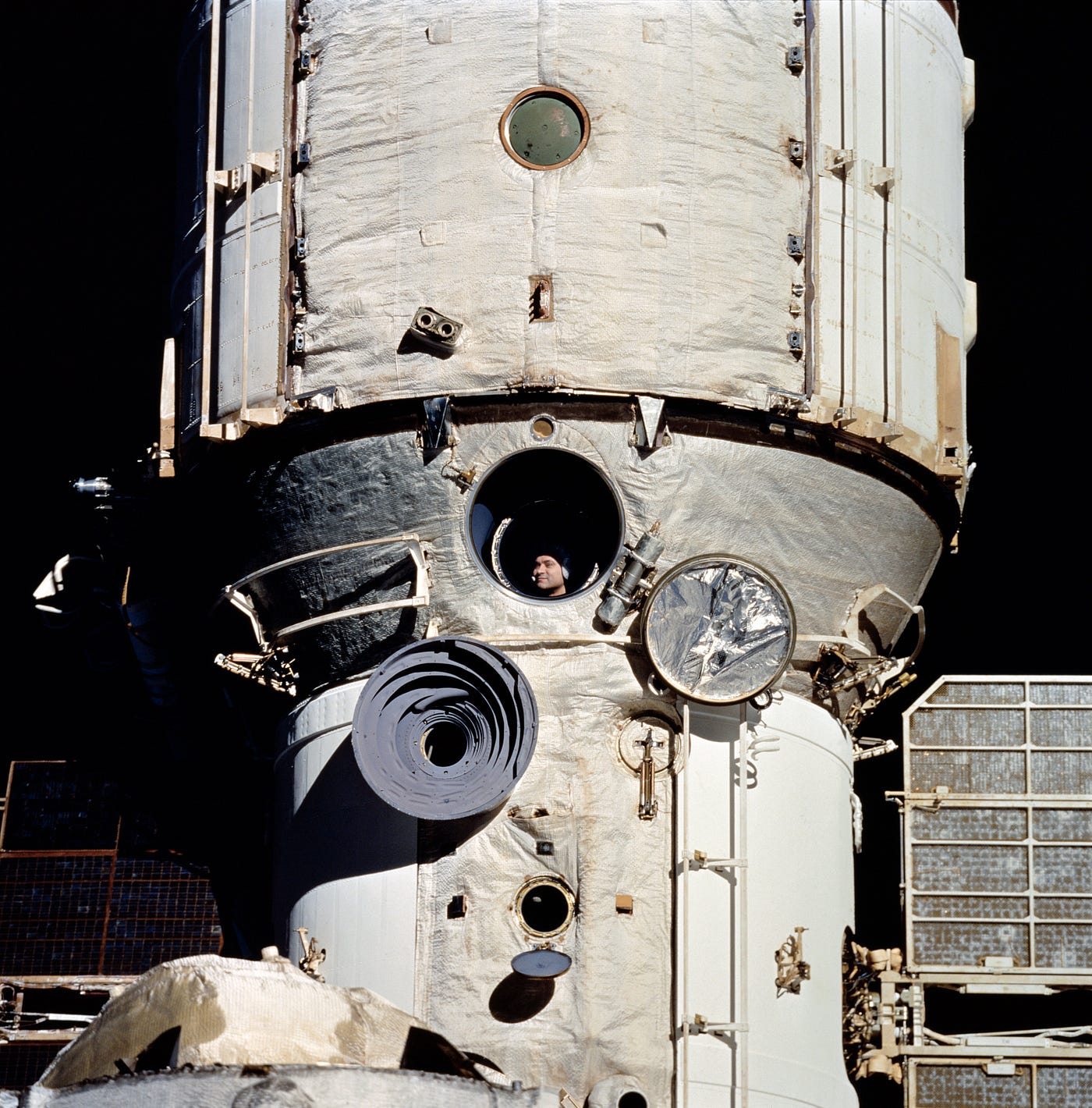 This photograph shows Cosmonaut Valeri Polyakov on February 6, 1995: thirteen months into his record-setting stay in space, aboard the Space Station Mir. The photograph was taken from NASA’s Space Shuttle Discovery (STS-63) during a rendezvous with the Mir Core Module. (Credit: NASA)