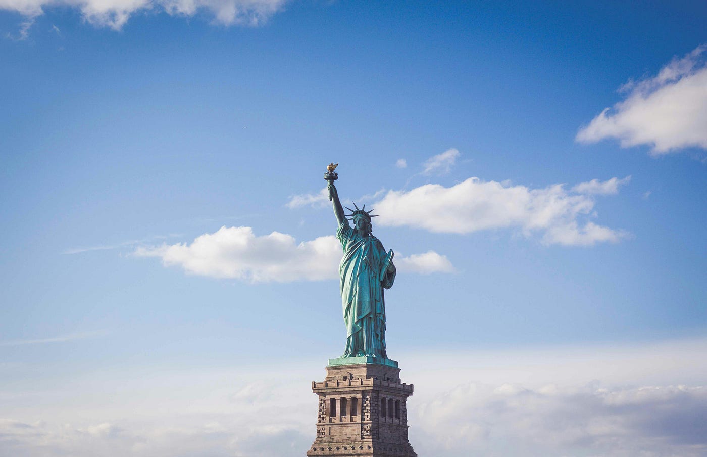 Seeing Lady Liberty on her perch will always be special. ❤️🤍💙 (Photo by Fernando Strabuli on Unsplash)