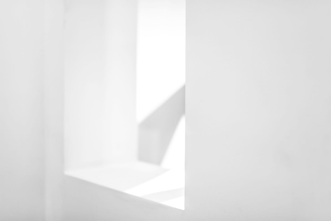 A white scene of a glassless window.