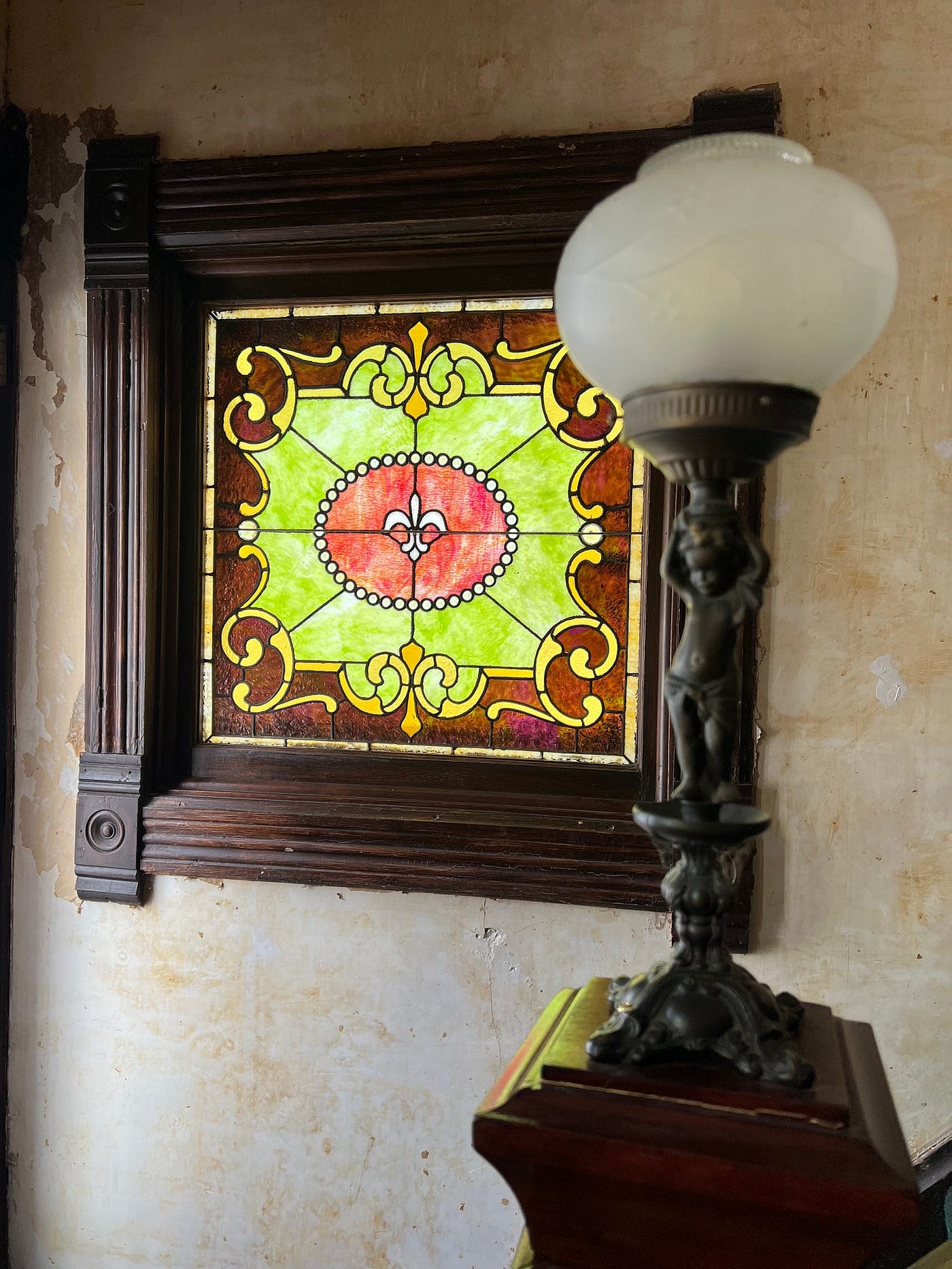 My house is not market-ready. But isn’t my newel post cool? And one of my stained windows is said to have come from my city’s old Carnegie Library. (Photo by Michelle Teheux)