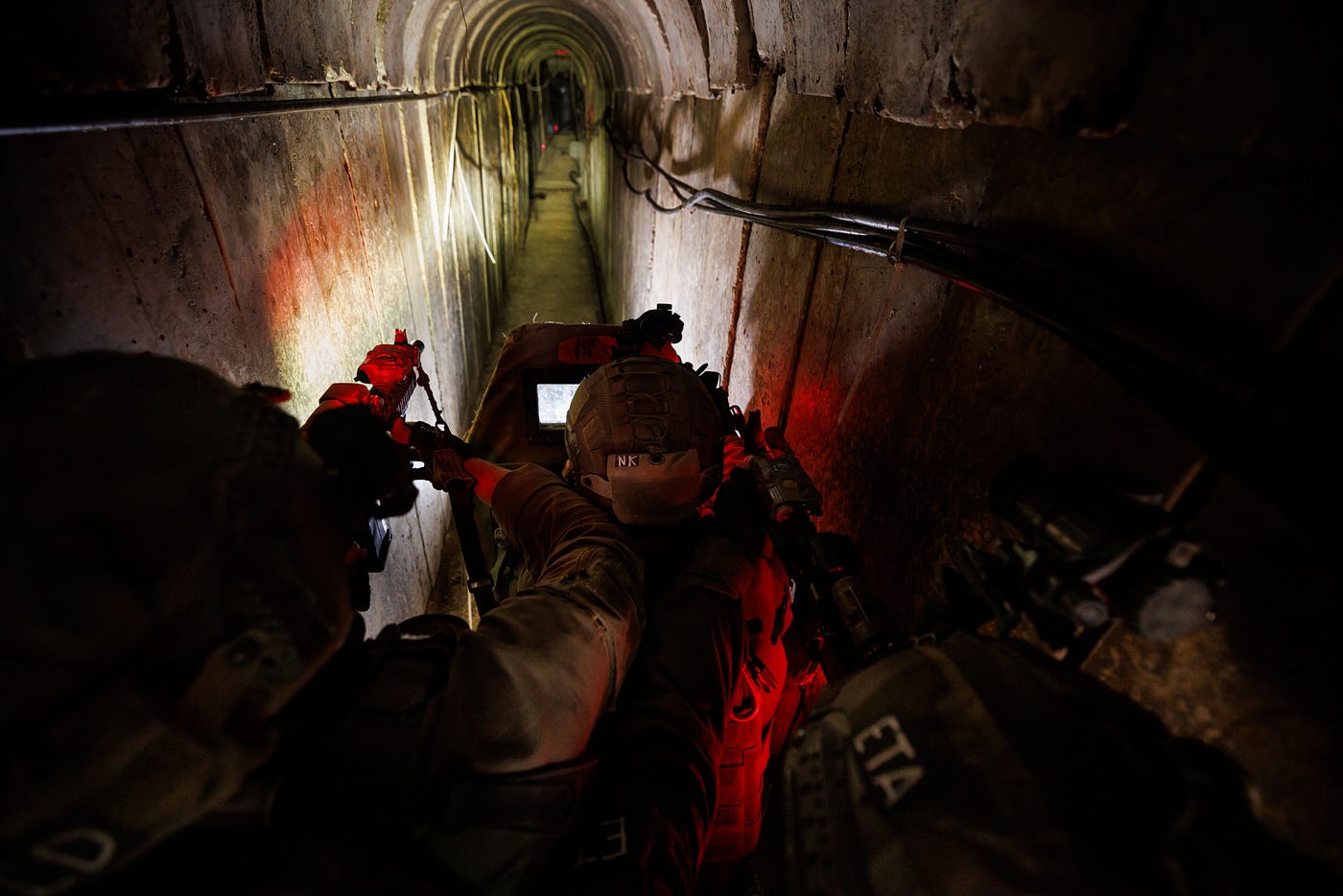 Israeli troops walk through what they said was an underground tunnel used by Hamas militants in Gaza.