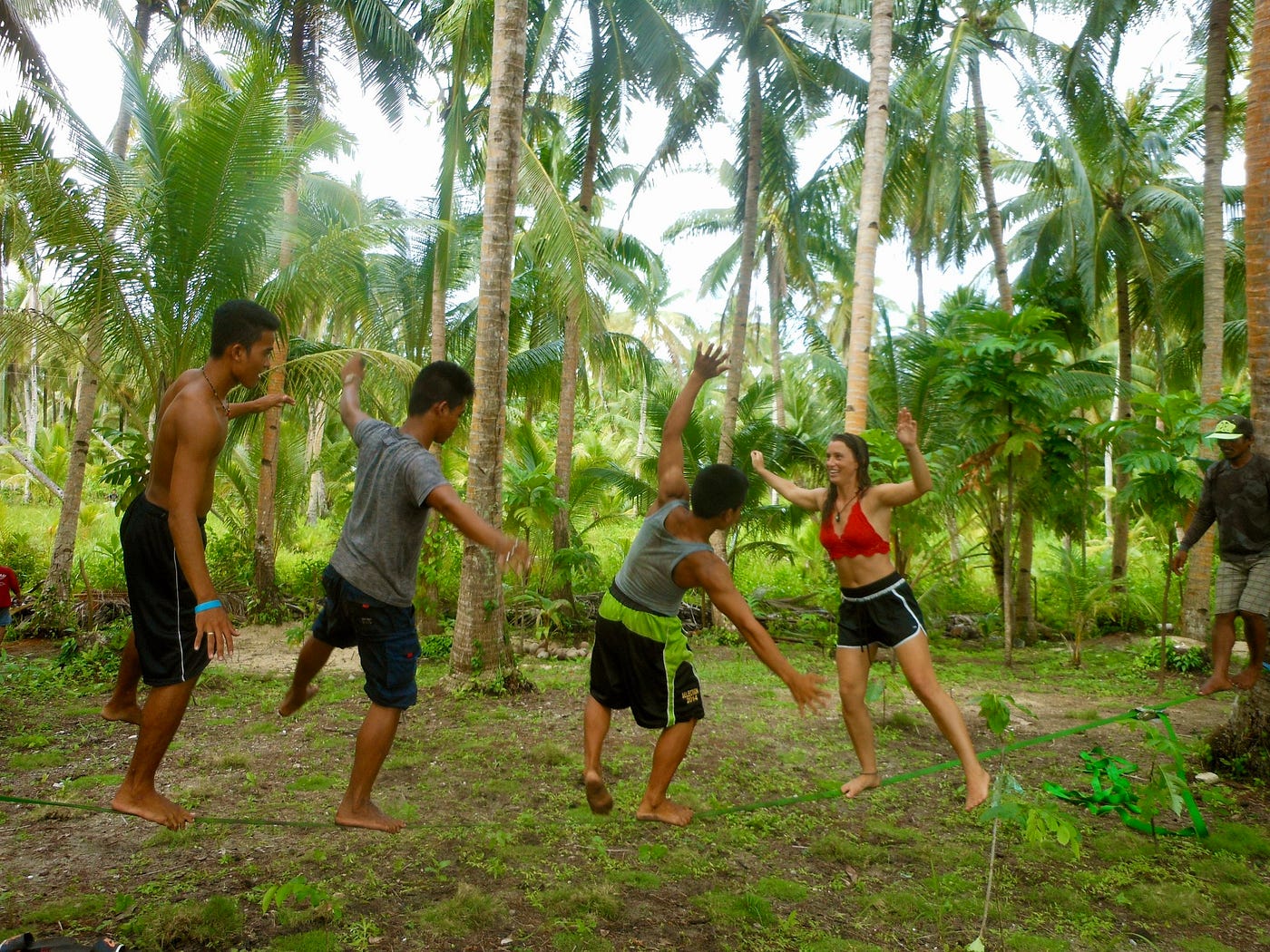 Three new friends, one slackline — the purest kind of wealth. No gadgets, no schedule, just smiles, wobbling steps, and connection. -Port Barton, Philippines, 2017