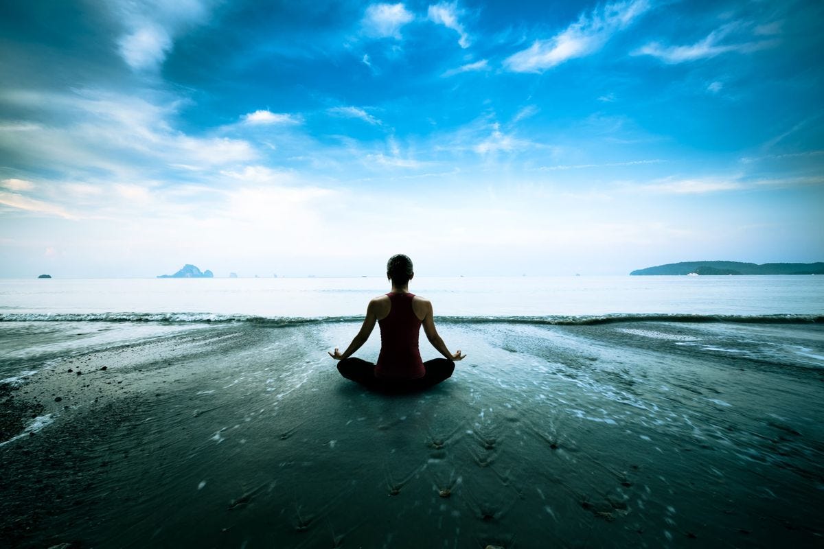 Image of a girl meditating by ocean. Articles By Dane Spotts