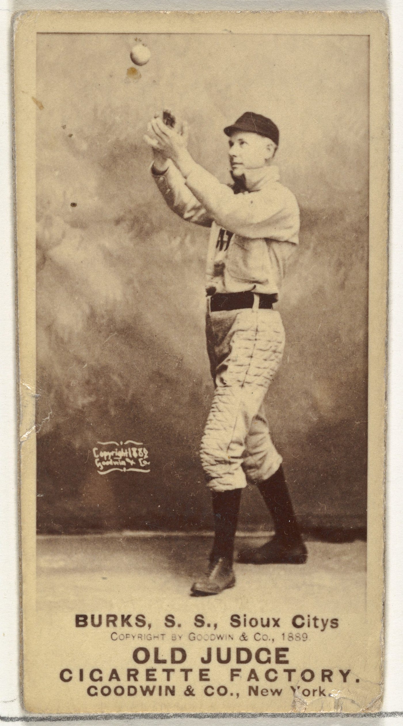 Third of three Burks cards in the Old Judge series (N172)