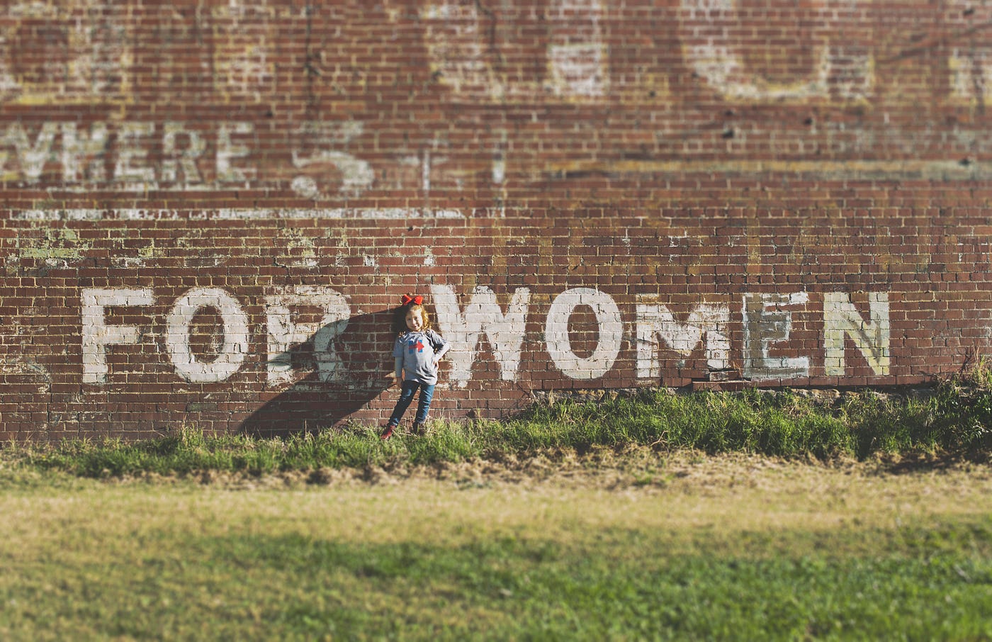 “FOR WOMEN” is spray painted on a brick wall. Grass is in the foreground. We don’t really know why there has been an increase in breast cancer among women in their 40s. But when more people in a certain age group are getting a condition, then screening of that group will be more impactful.